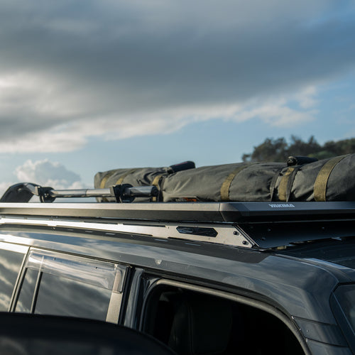 RuggedLine HD and Roof rack platform with bags on a vehicle against a cloudy sky